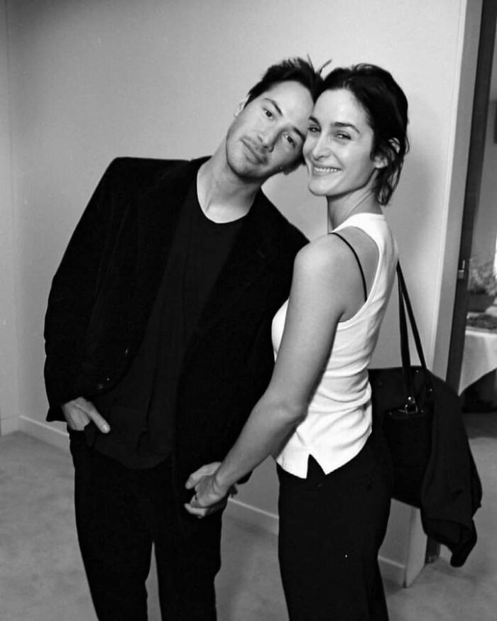 26. Keanu Reeves and Carrie-Anne Moss celebrating the release of 