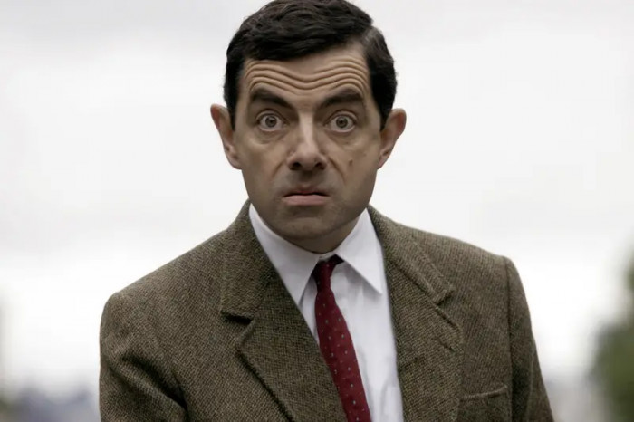 18. Rowan Atkinson acting as Mr. Bean