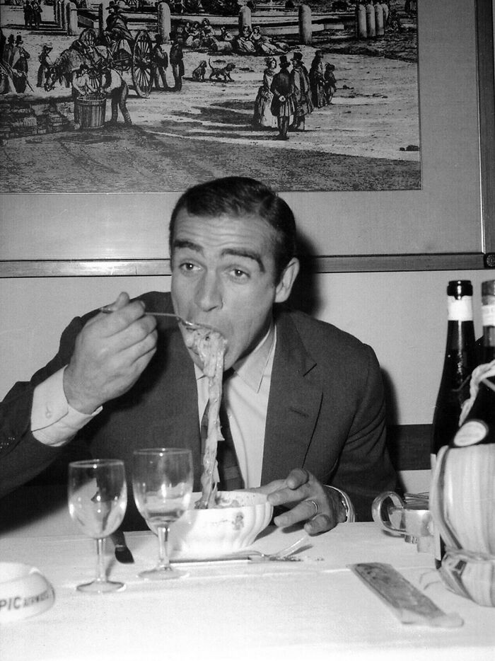 40. Sean Connery having pasta in 1963