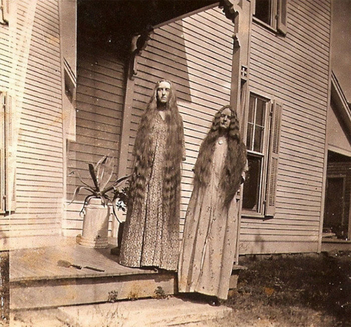 18. "Photo Of Two Women With Super Long Hair"