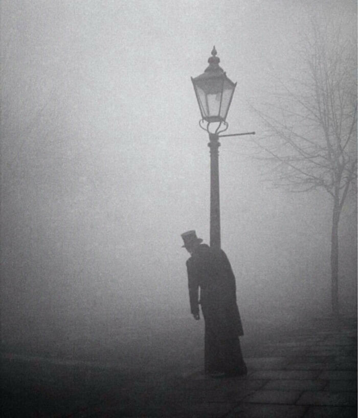 17. "A Drunken Man In Top Hat And Tails Clings To A Lamp-Post, London, 1934. Photo By Bill Brandt"