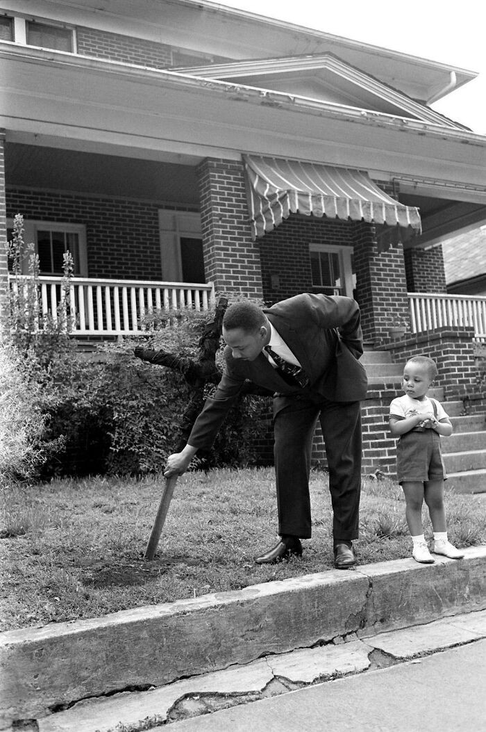 1. "Martin Luther King Jr. With His Son, Pulling Up A Burnt Cross From The Front Lawn Of His Atlanta Home, April 1960"