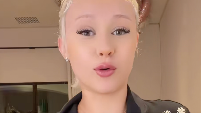 Alabama Barker stands near Travis Barker amid controversy over personal gift