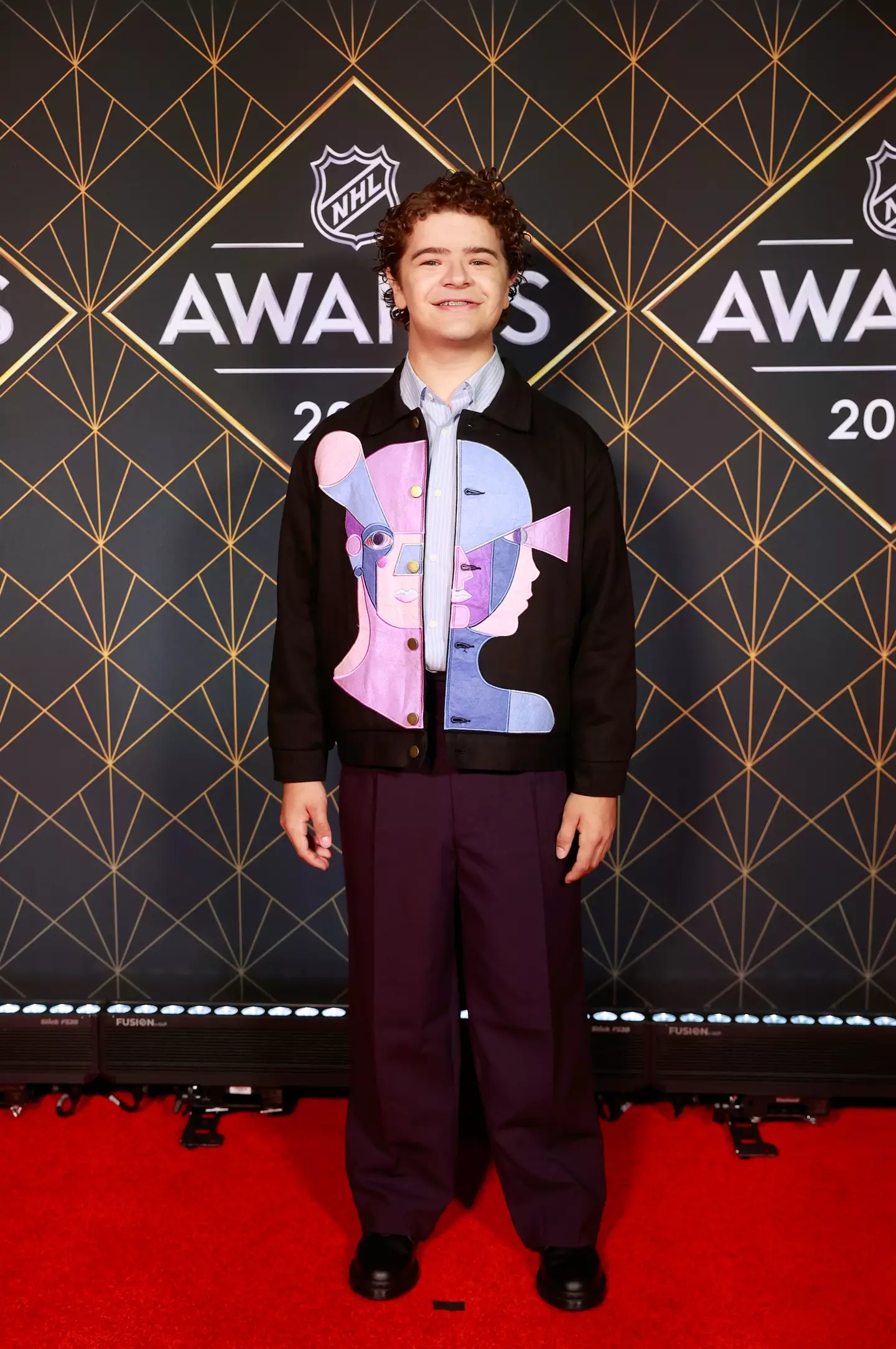 We’ve watched Gaten grow up, and let’s just say his style game is leveling up faster than Eleven’s powers.