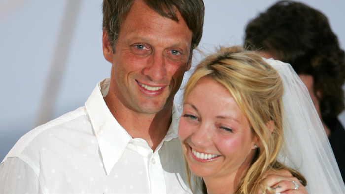 Tony Hawk and a journalist at an interview, addressing misinformation about Epstein’s Tavarua island