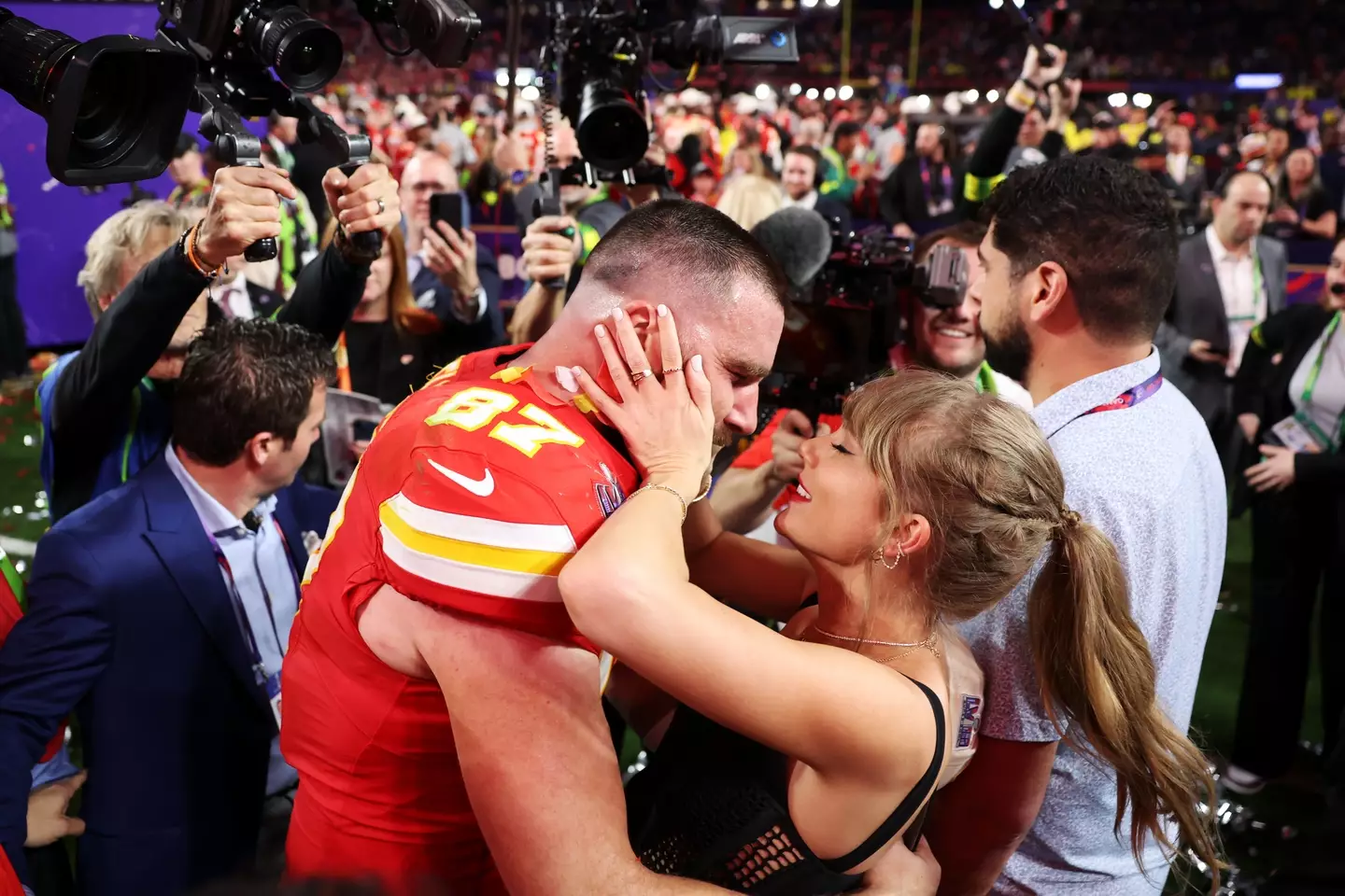 This infamous moment shows Taylor and Travis sharing a kiss following the Super Bowl win.