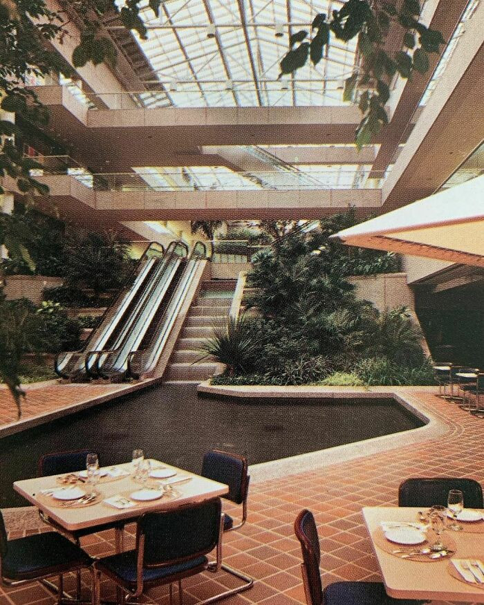 17. When Your Office Building Has A Foyer With A Restaurant, Waterfall With Pond, Skylight, And Tropical Planting 🌴 Commercial Interiors International - Grosvenor Press 1986