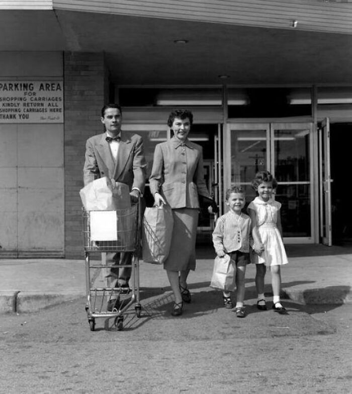 "Family Walking Out Of A Supermarket Pushing A Grocery Cart, 1950s"