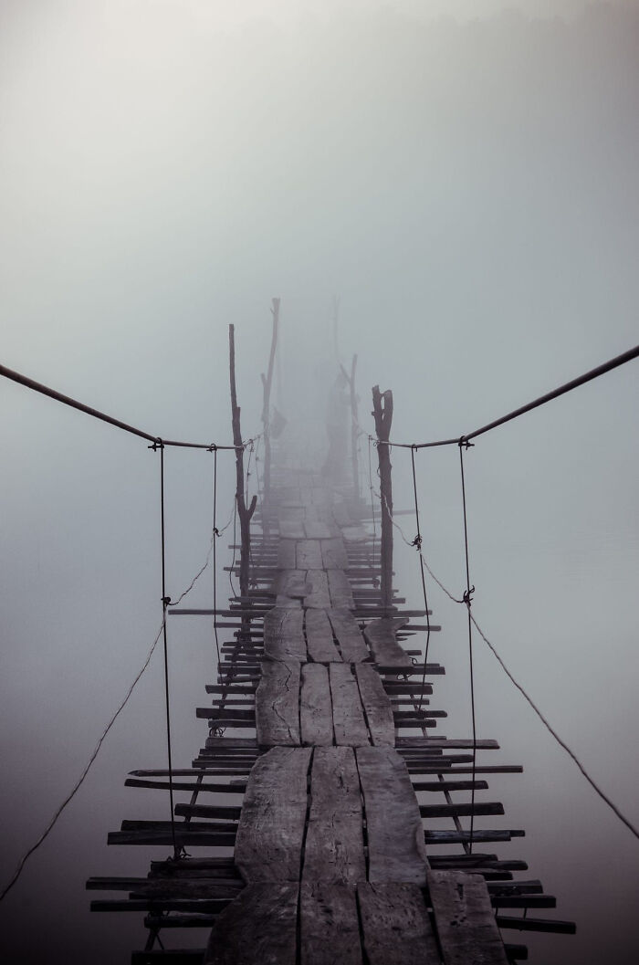 26. A Rickety Old Foot Bridge Leading Into The Misty Distance