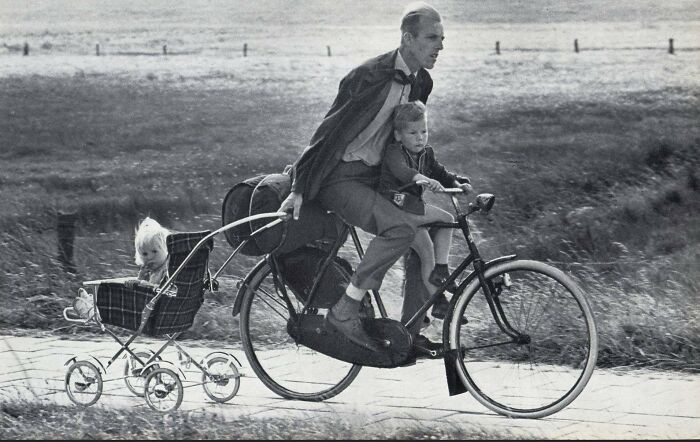 "A 1966 Photo From The Netherlands Dubbed The “Dutchiest Father Of All Time” Captures A Father Fully Embracing Classic Mid-1960s Dutch Practicality"