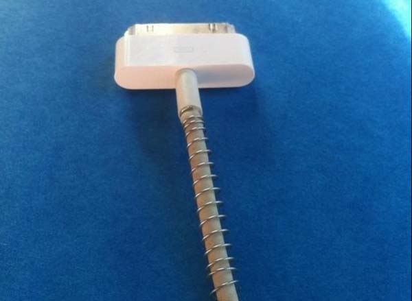Got any old knock-type pens? Use the string to reinforce your charger cord.