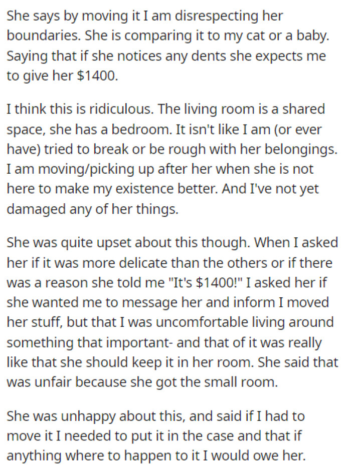OP explains why their roommate doesn't want her to move the guitar and states that if anything happens to it, then it's on OP.