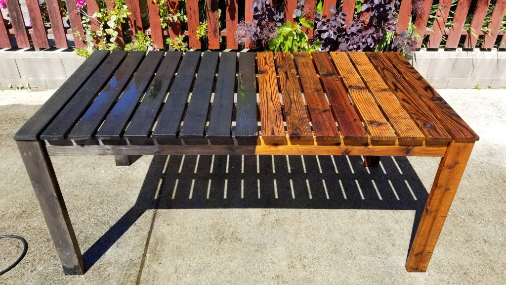 23. washing an outdoor redwood table - paused half way through to appreciate the difference. 