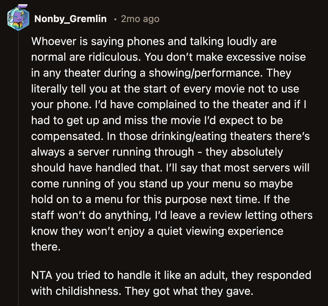 OP tried to talk to the woman reasonably at first. Sure, OP could have reported the issue to theater staff, but the popcorn was just as effective.