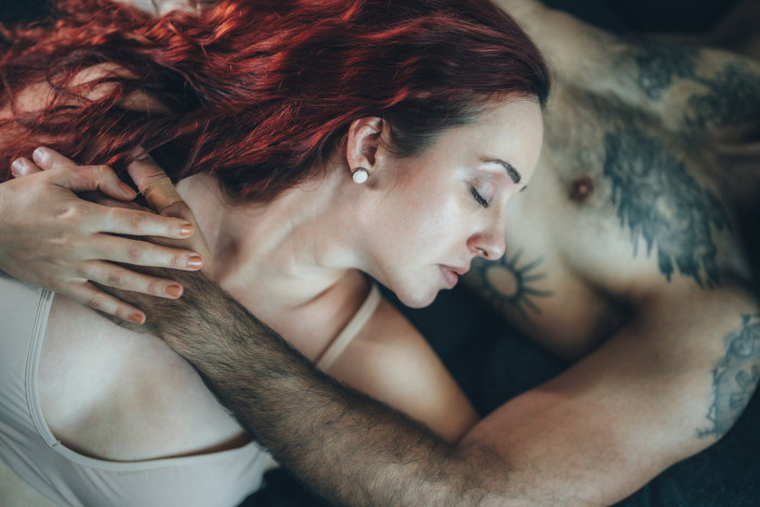 Sex therapist speaking with a couple, emphasizing communication and intimacy building