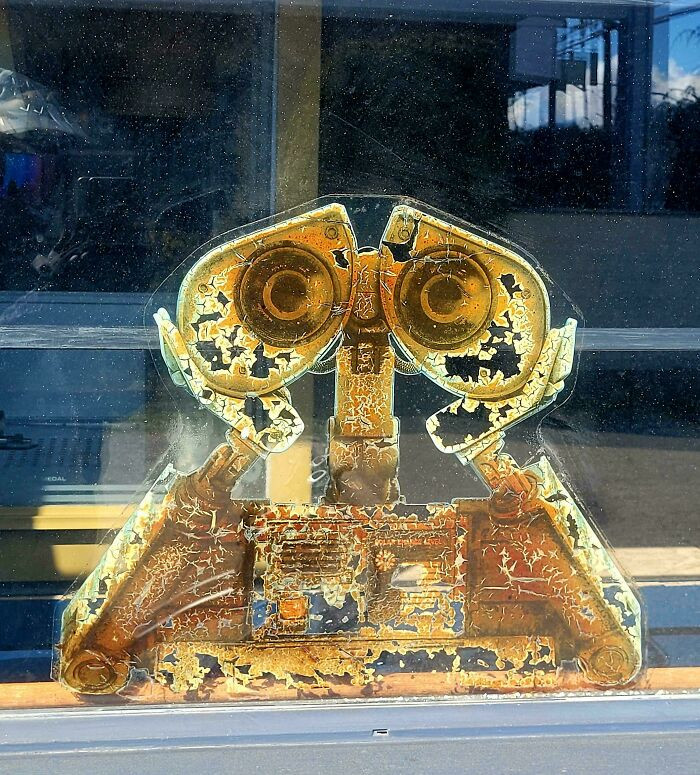 "Original Sun-Beaten 2008 Wall-E Sticker Still In Local Cinema Window"