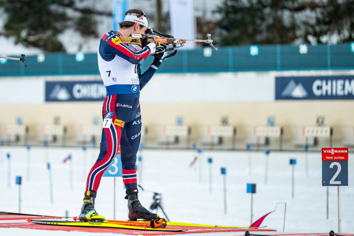 Olympic podium winner Lægreid speaking during live television interview, tense expression