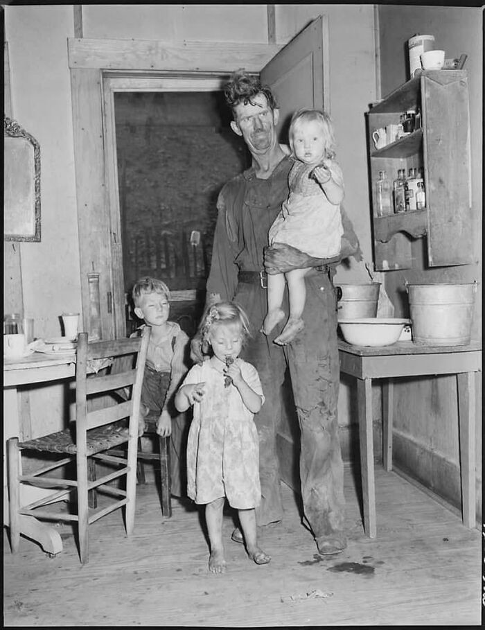 A 60-year-old man pictured with his wife and child in Kentucky, shortly after World War II.