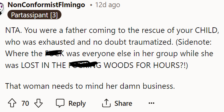 The woman does need to mind her business, but she also shouldn't be concerned with what someone else's dad is doing to comfort their child after being lost in the woods.
