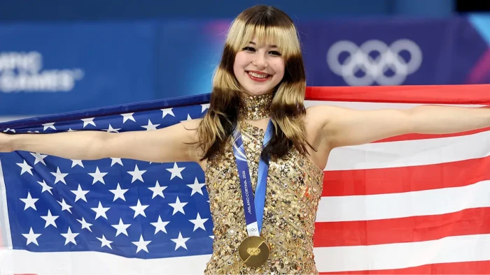 Alysa Liu with supporters at an Olympic venue, highlighting activism and pressure