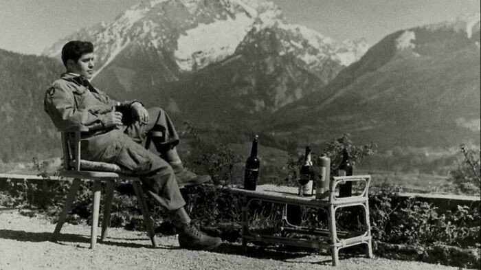 "A Soldier of the American 101st Airborne Division, Drinking and Admiring the View at Berchtesgaden. WWII, 1945."