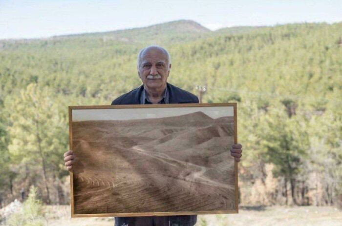 "Man Posing With Picture Of Forest He Restored"