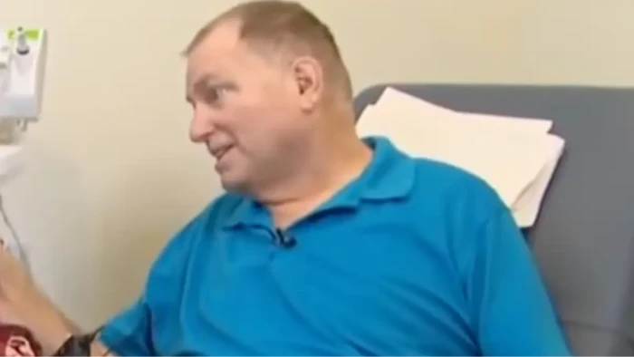 Patient Andrews smiling during recovery after pig and human kidney transplant