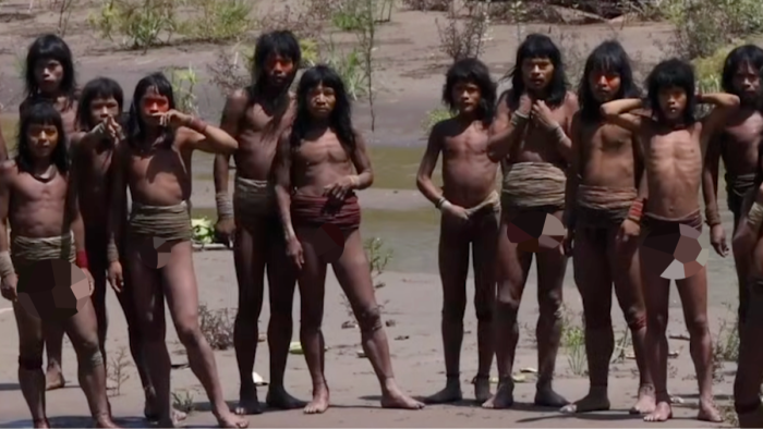 Indigenous Mashco Piro tribe member using distinctive gestures, isolated in rainforest