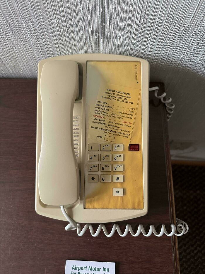 "The Sun Damage On This Motel Telephone Avoids The Shadow Of The Phone Itself"