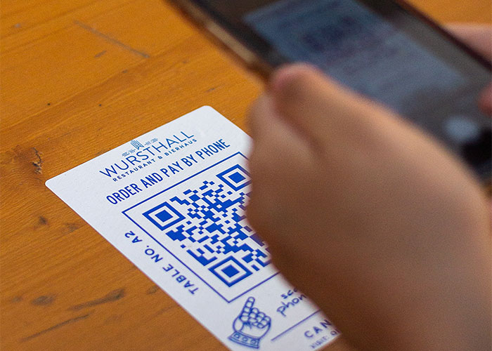 No need for fancy QR codes—classic paper menus signal a focus on the food rather than gimmicks.