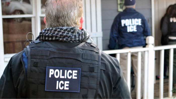 ICE agent speaking outdoors, addressing career choice and challenging training experience