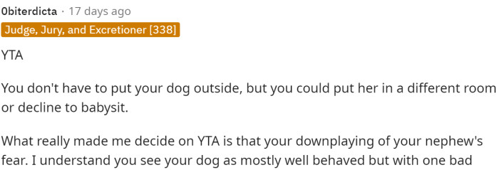 This comment labeled OP as TA in this situation because she could separate the dog and is downplaying the nephew's fear.