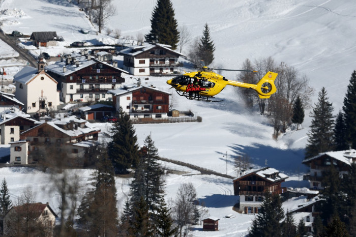 Skiing champion Lindsay Vonn in racing gear, injured after a downhill crash.