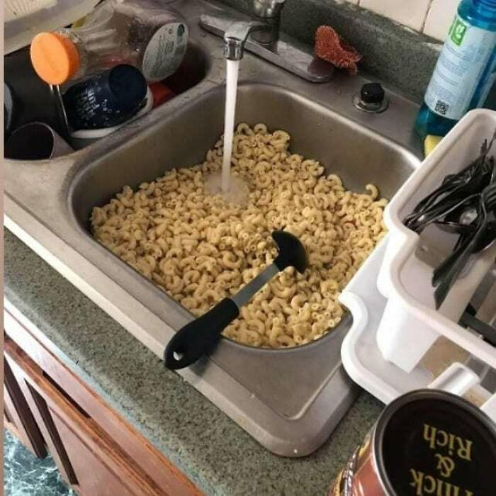 I don't think many of us would eat anything from this kitchen, especially the noodles. Why not use a strainer?