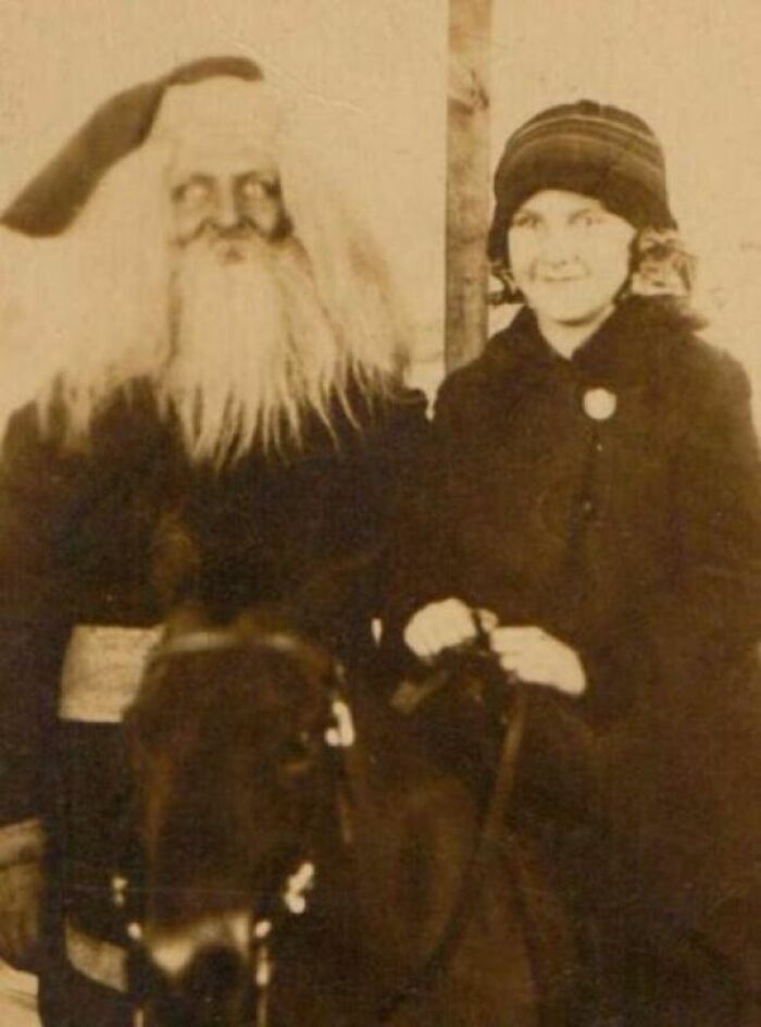 "A Girl On A Horse Beside Santa Claus"