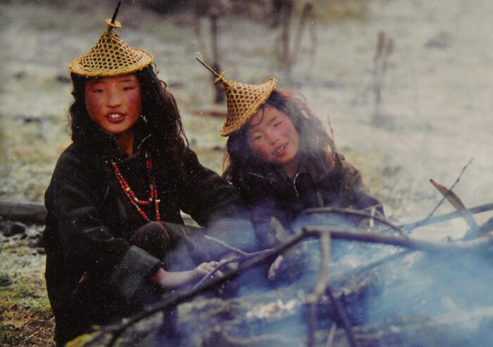 Girls From The Village Of Laya In Bhutan Wear Traditional Hats Made From Woven Bamboo. Olivier Föllmi