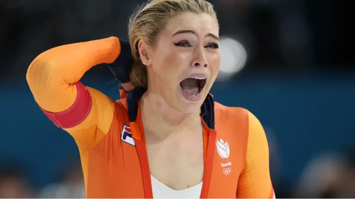 Jutta Leerdam celebrates a speed skating gold medal, smiling through tears.