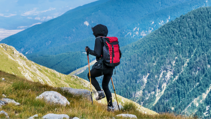 Woman traveler standing outdoors, discussing safety concerns after visiting many countries