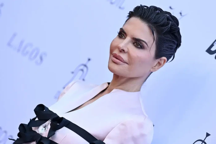 Lisa Rinna and Harry Hamlin posing as proud parents with daughters