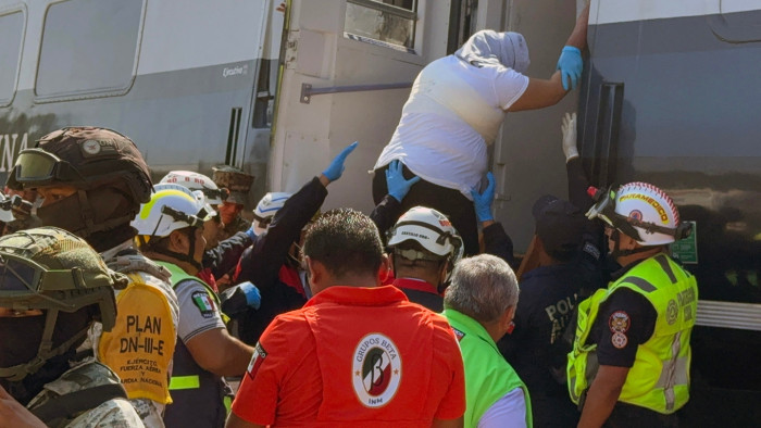 Rescuers assist victims after Mexico train derailment, slope rescue scene near Nizanda