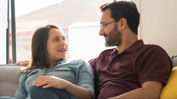 Partners discussing disagreements calmly, demonstrating effective conflict resolution techniques