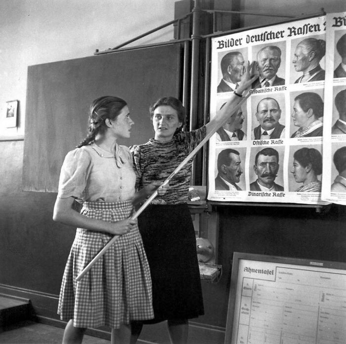 A German student attending a race-based lesson in Nazi Germany, 1943.