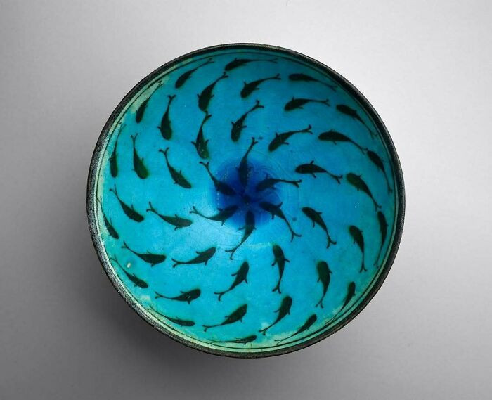 A blue fish-designed bowl from Iran, dating to the late 13th–mid-14th century.