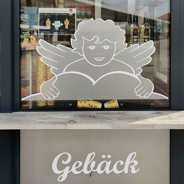 20. This Is The Logo Of A Local Bakery. Looks Like The Angel Is About To Eat Some A**