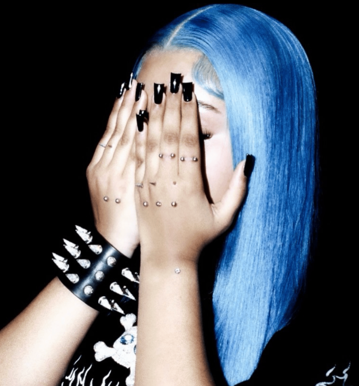 North West, age 12, poses in a bold new style.