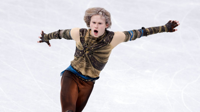 US Olympic figure skater Ilia Malinin performing a backflip on ice
