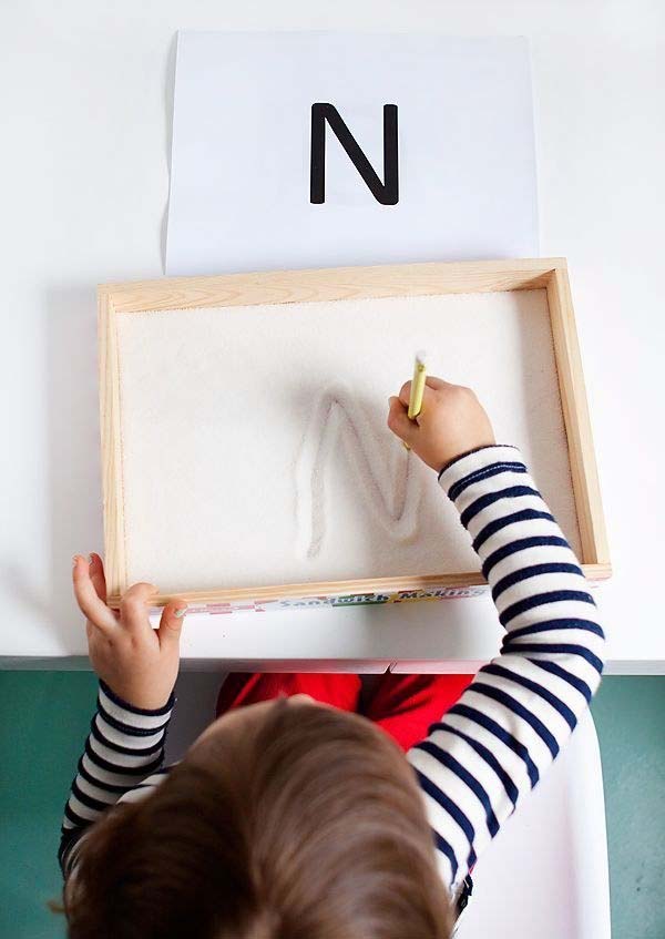 15. Let kids practice their letters in this sugar writing tray