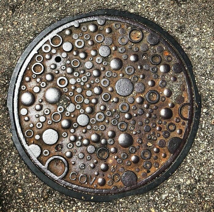 43. A stunning manhole cover, showcasing remarkable artistic freedom granted by the city commission.