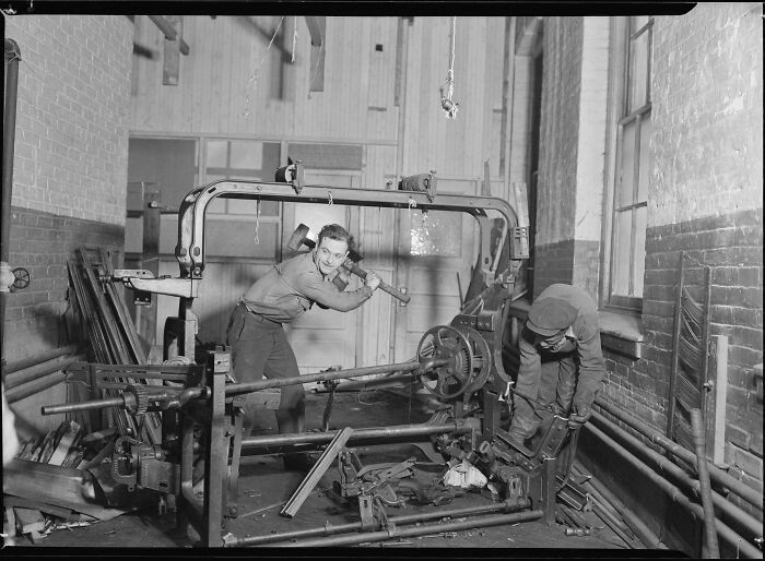 "Lewis Hine, Junkies Breaking Up Old Looms To Be Sold For Scrap-Iron And Said To Be Sent To Japan For Munitions, 1936"