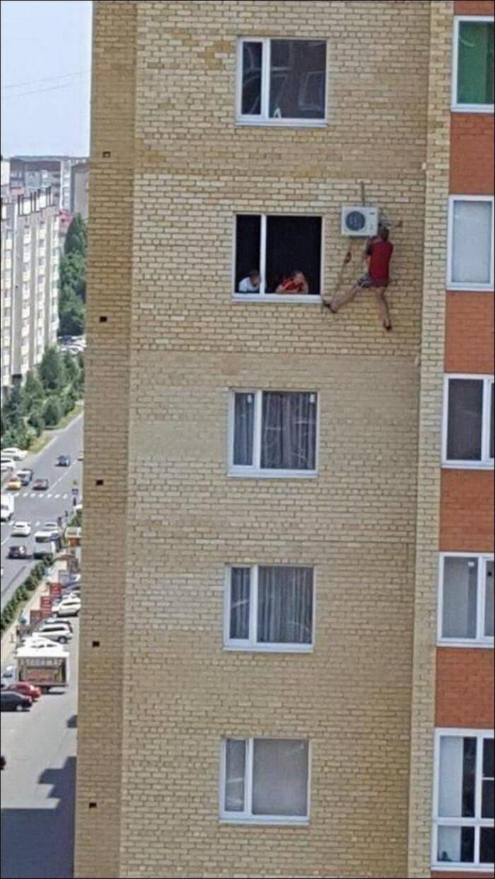 11. Russian guy fixing his air conditioning